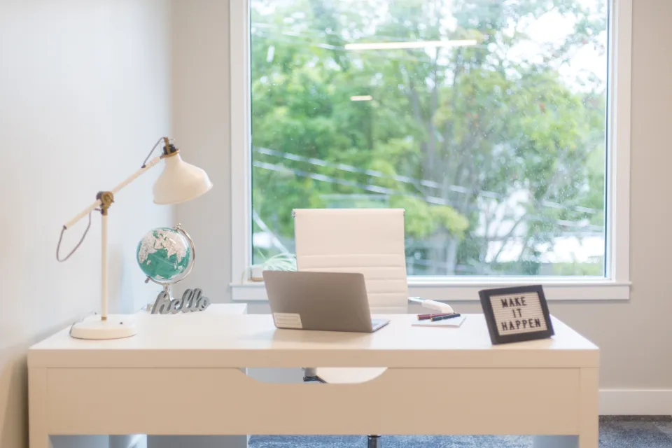 A bright home desk by a window