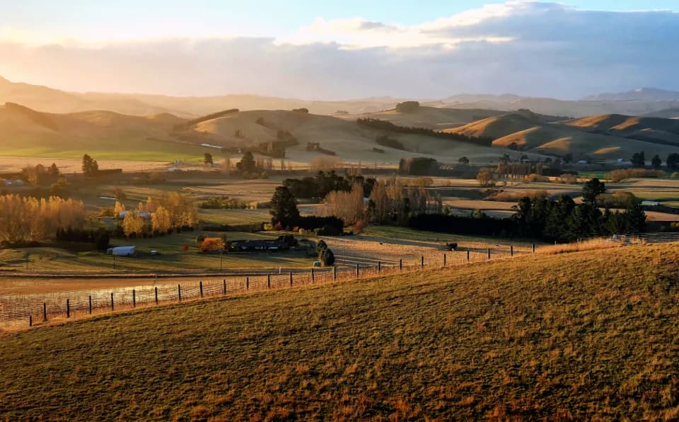 Rolling farmland under an open sky