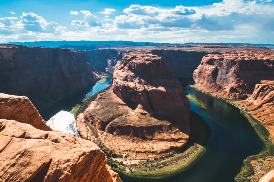 The Colorado River curving through desert canyon
