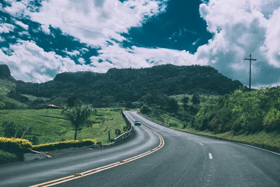 A road winding through green American hills