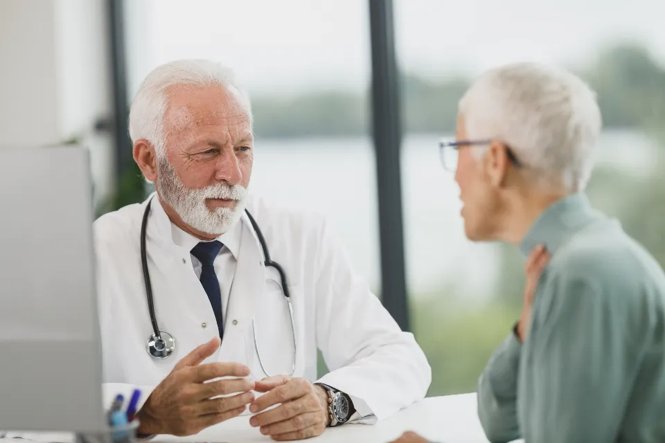 A doctor talking a patient through her coverage options